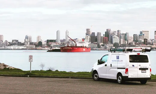 Washington Alarm van in front of Seattle Skyline