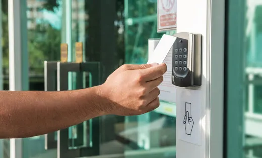 using a keycard to scan into a commercial building