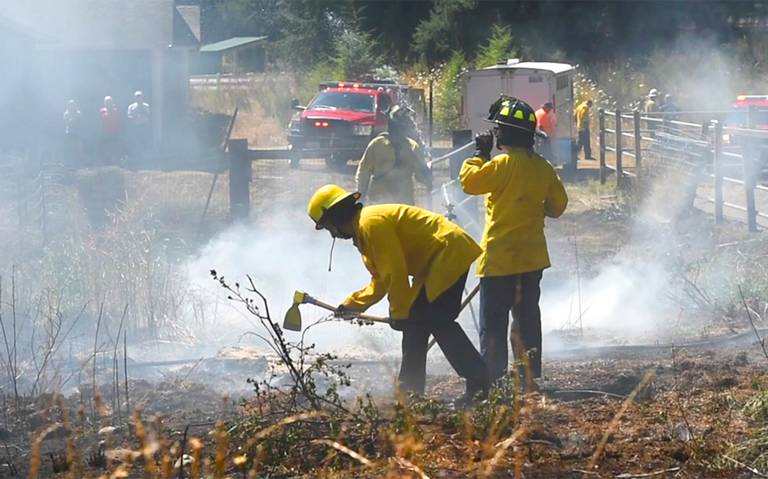 Rochester pasture fire spreads rapidly in dry heat, damages property